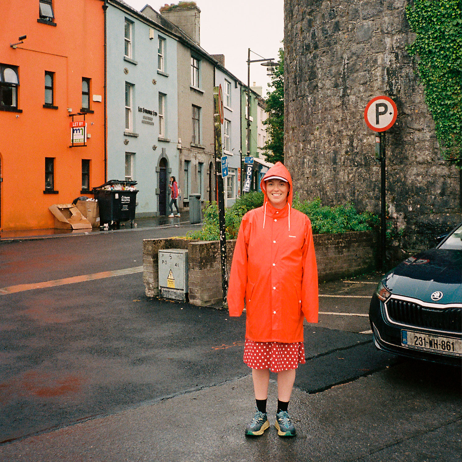 Siobhan Barry standing in an orange rainjacket in Ireland