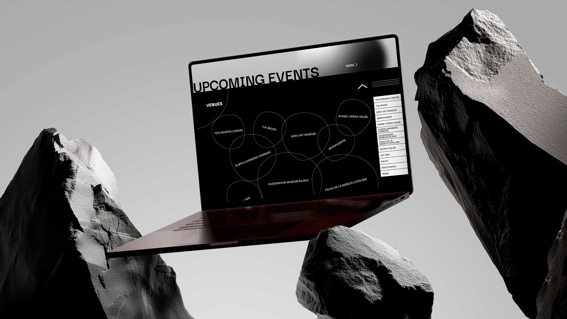 laptop displaying ui design balanced on display rocks with gradient background